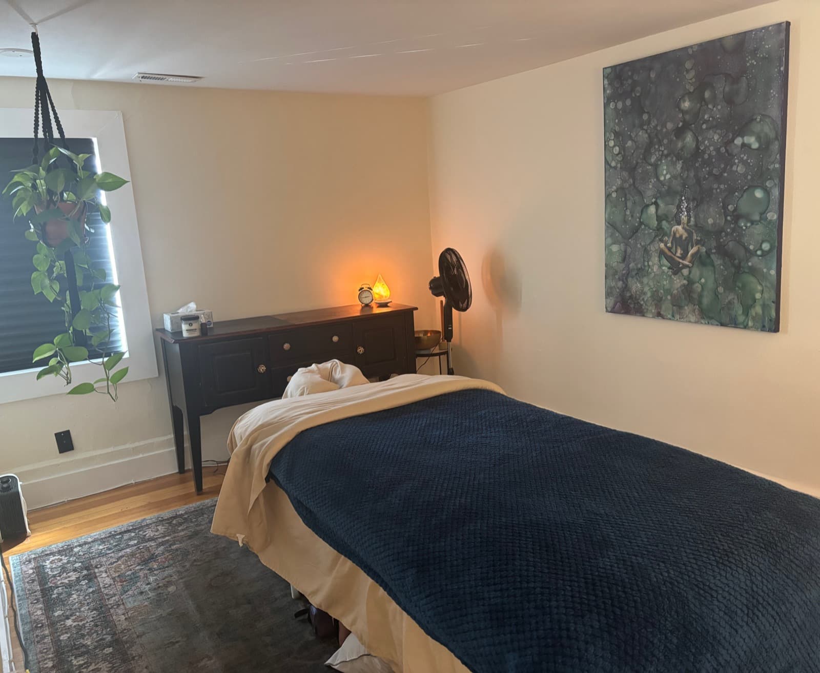 Frixtion Spa massage room with art and warm lighting